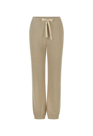 a-pair-of-beige-wide-leg-jogger-pants-with-an-elastic-waistband-and-a-matching-beige-drawstring-tie-shown-against-a-plain-white-background