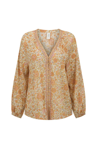a-long-sleeve-v-neck-blouse-with-a-dense-floral-and-paisley-print-in-shades-of-orange-beige-and-yellow-shown-against-a-plain-white-background