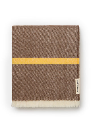a-folded-brown-woven-blanket-with-a-horizontal-yellow-stripe-and-a-white-fringed-edge-shown-on-a-clean-white-background